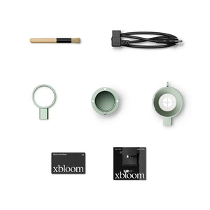 Tillbehör till sagegrön xBloom med rengöringsborste kabel och bryggdelar allt om kaffe